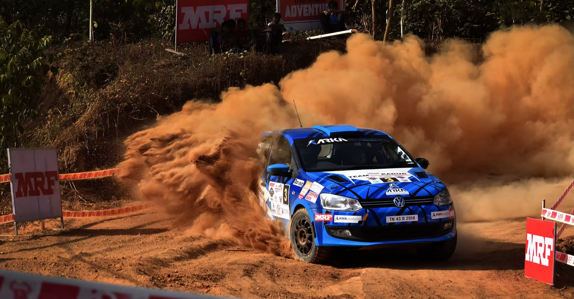 Arka Motorsports rally car sliding through gravel — RaceSims Academy Rally Car Experience